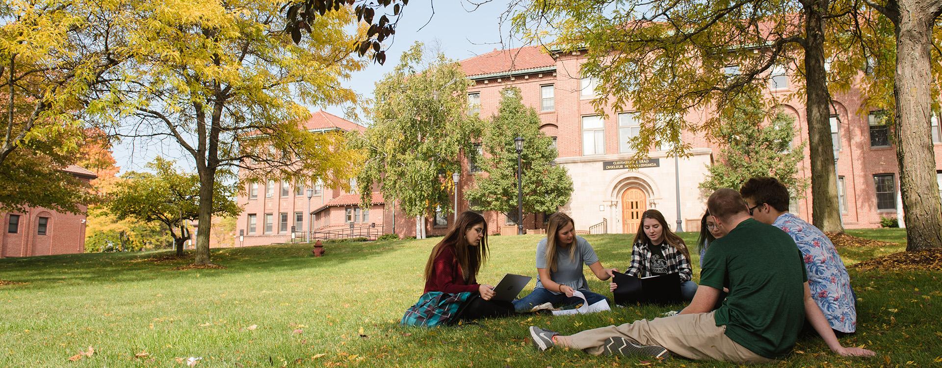Students studying in the grass on WLC campus